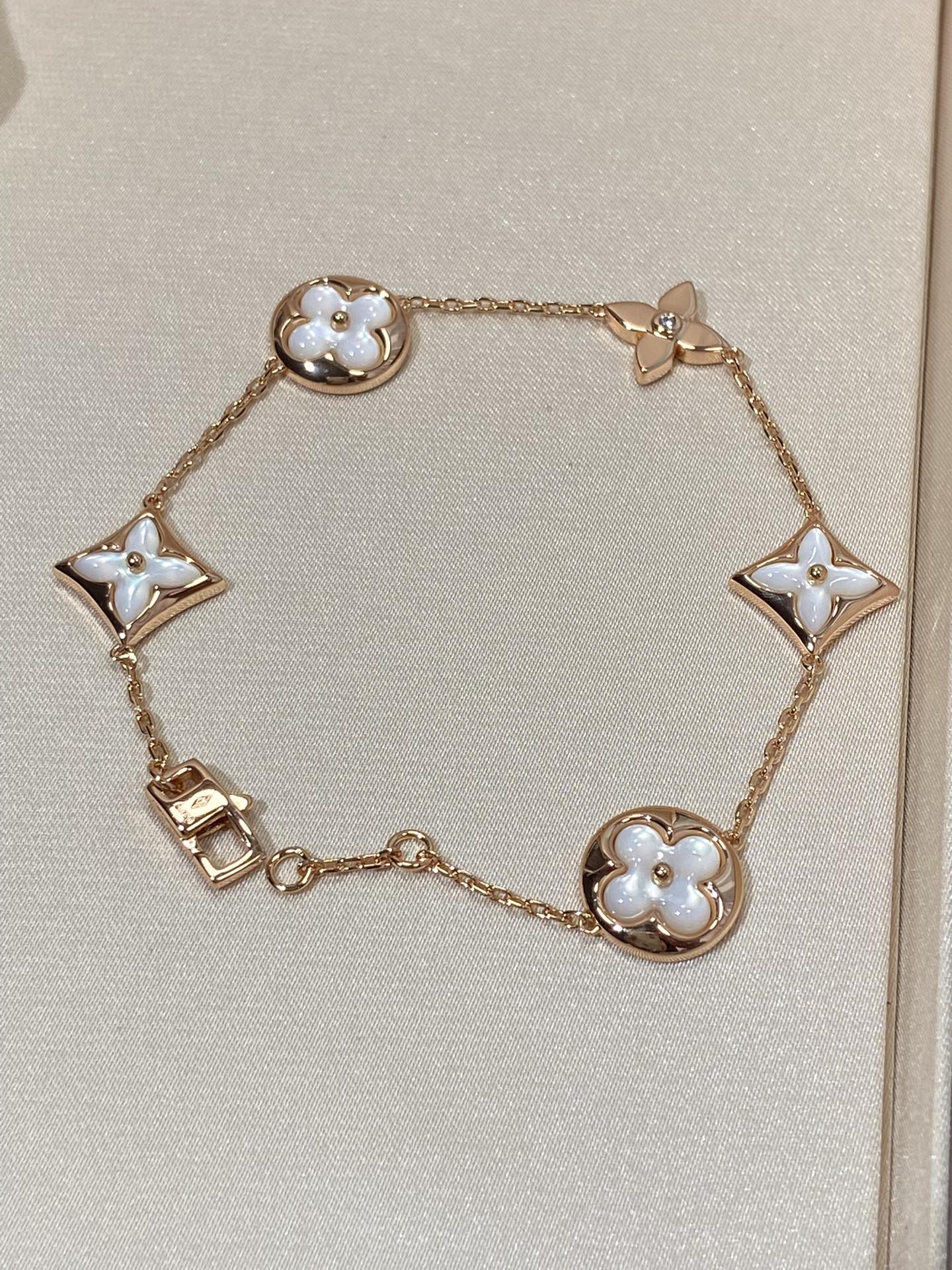[Star Jewelry]STAR AND SUN 5 MOTIF MOP PINK GOLD BRACELET
